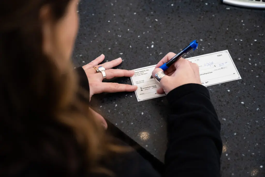 Woman writing check