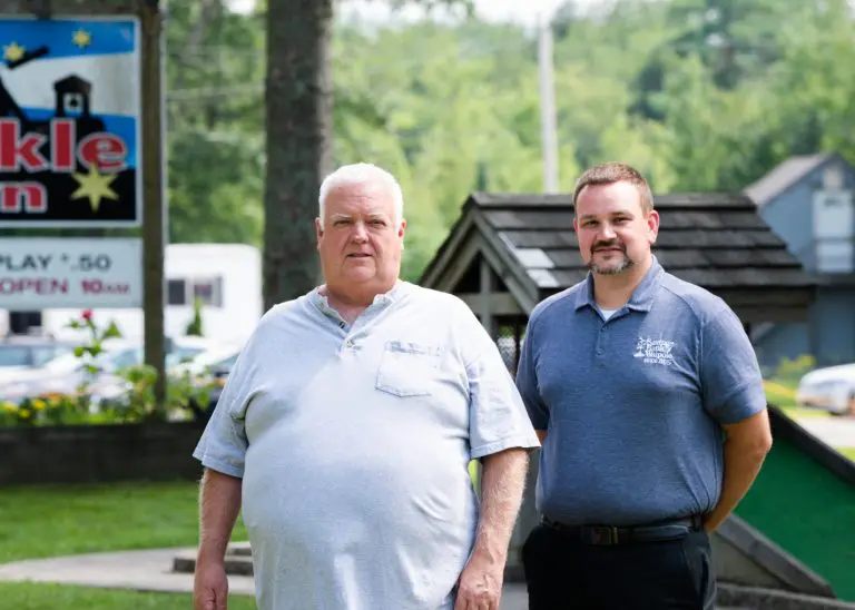 Paul Thomas with Andrew standing outside of Twinkle Town