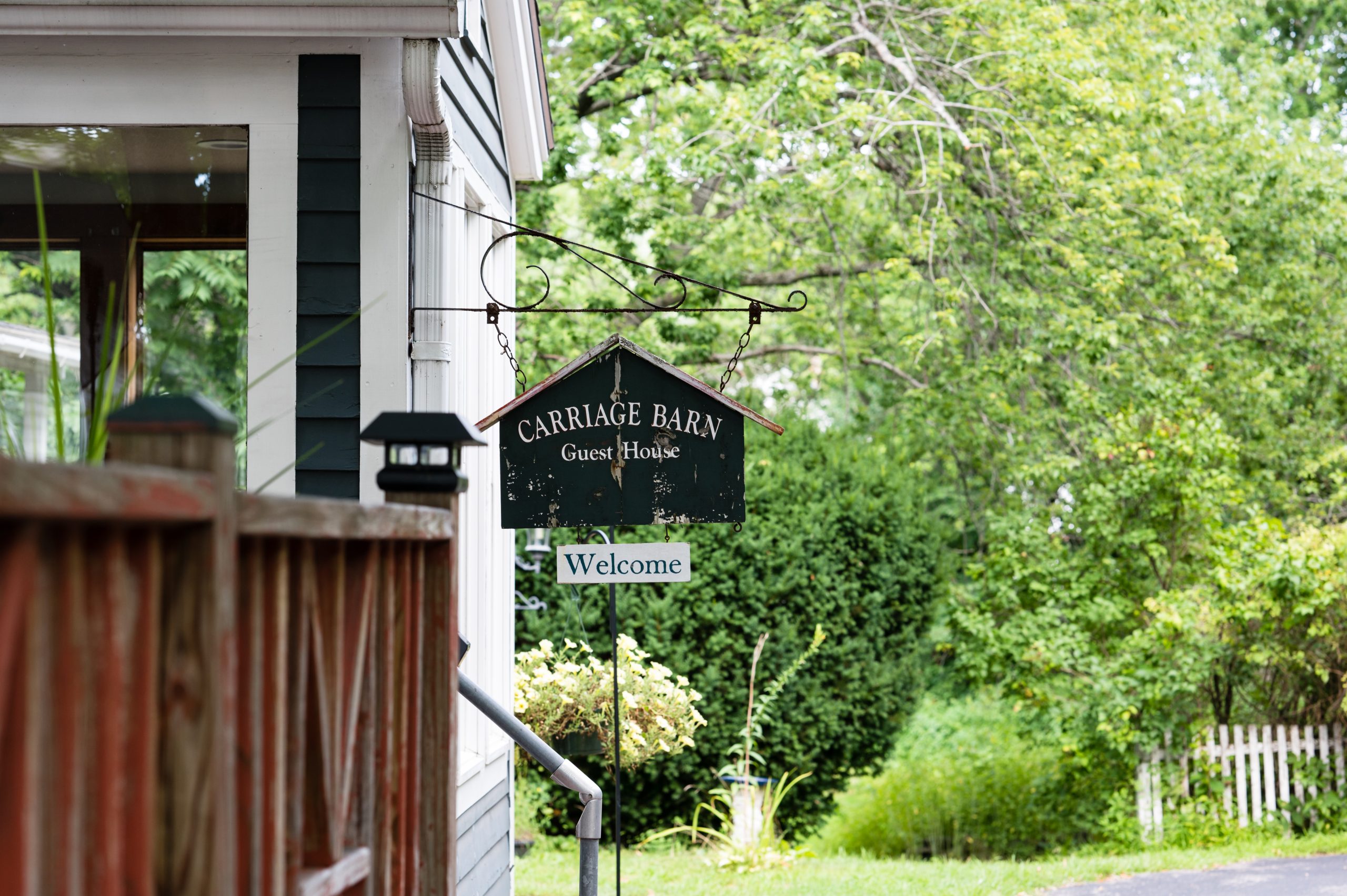A secondary sign for the Carriage Barn Inn